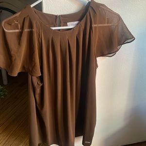 Beautiful top to wear under a jacket . Wear it three times only